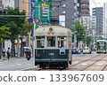 Hiroshima Electric Railway No. 156, an atomic bomb-damaged tram, runs through the rebuilt city of Hiroshima 80 years after the atomic bombing 133967609
