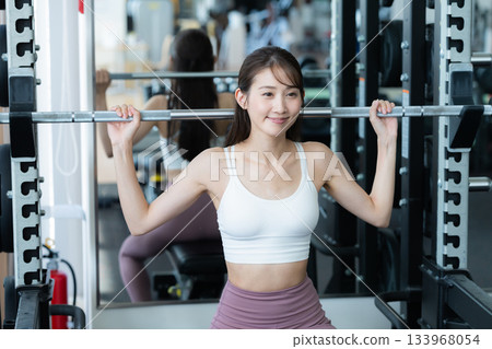 Young woman training in the gym Young woman training in the gym 133968054