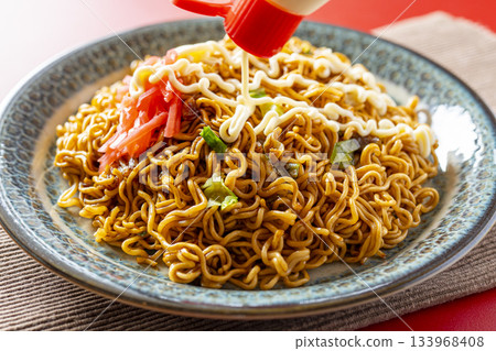 Cup Yakisoba Served on a Plate 133968408