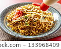 Cup Yakisoba Served on a Plate 133968409