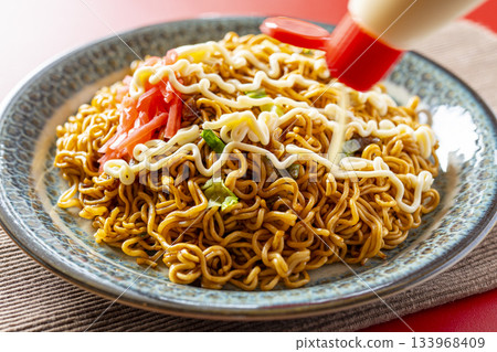 Cup Yakisoba Served on a Plate 133968409
