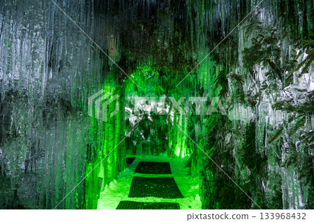 Waterfall-like icicles in a fantastical green tunnel Waterfall-like icicles in a fantastical green tunnel 133968432