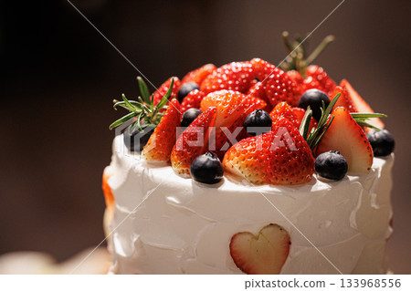 A picture of a big cream cake with lots of strawberries on top Wedding cake A picture of a big cream cake with lots of strawberries on top Wedding cake 133968556