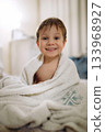 cute little boy at home wrapped in towel after bath. High quality photo 133968927