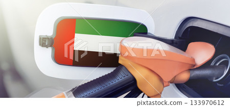 The flag of the United Arab Emirates on the lid of the gas tank of a car at a gas station in close-up. High or low gasoline prices at UAE gas stations. Gasoline prices are rising due to a shortage of 133970612
