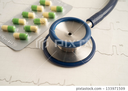 Stethoscope on electrocardiogram ECG, heart wave, heart attack, cardiogram report. Stethoscope on electrocardiogram ECG, heart wave, heart attack, cardiogram report. 133971509