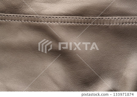 Closeup texture full grain gray brown leather with seam 133971874