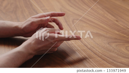 man hand suggestions gesture on black walnut table man hand suggestions gesture on black walnut table 133971949