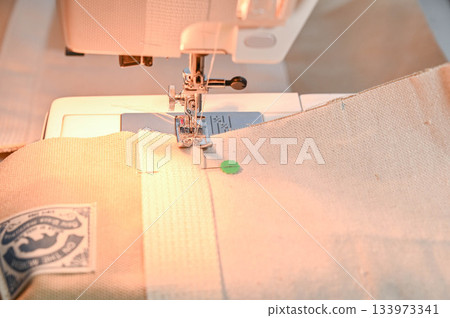 Sew bag tape onto canvas Sew bag tape onto canvas 133973341