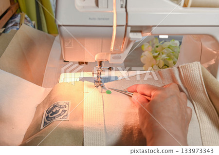 Sew bag tape onto canvas Sew bag tape onto canvas 133973343