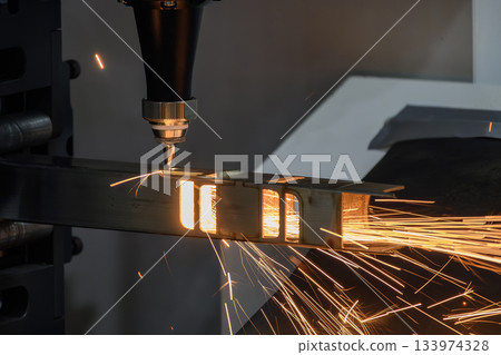 Close up scene the fiber laser cutting machine cut  the square stainless steel tube. 133974328