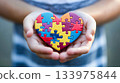 Chileren hands holding jigsaw puzzle heart. 133975844