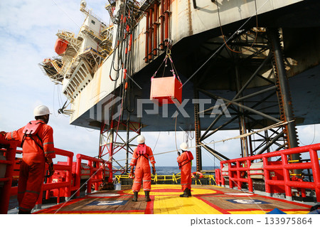 Crews boat moving the passenger and cargo from the platform to supply boat in oil and gas industry. Support offshore oil and gas industry by boat and service team. Crews boat moving the passenger and cargo from the platform to supply boat in oil and gas industry. Support offshore oil and gas industry by boat and service team. 133975864