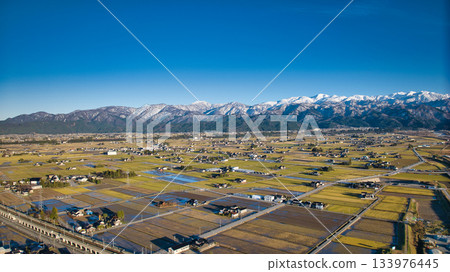 Scenery of the Kurobe River alluvial fan, the Northern Alps, the Shinkansen viaduct, and the Hokuriku Expressway in early December Scenery of the Kurobe River alluvial fan, the Northern Alps, the Shinkansen viaduct, and the Hokuriku Expressway in early December 133976445