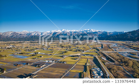 Scenery of the Kurobe River alluvial fan, the Northern Alps, the Shinkansen viaduct, and the Hokuriku Expressway in early December Scenery of the Kurobe River alluvial fan, the Northern Alps, the Shinkansen viaduct, and the Hokuriku Expressway in early December 133976448