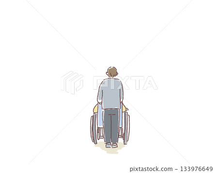 Rear view of a man pushing a wheelchair 133976649
