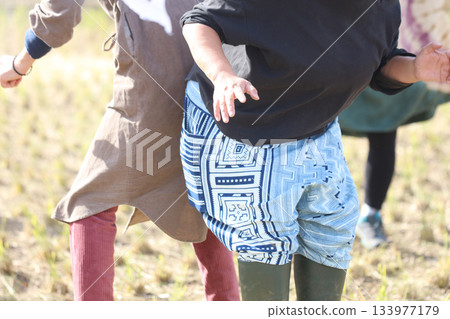 A woman wrestling with her buttocks A woman wrestling with her buttocks 133977179