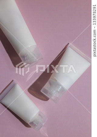 Minimalist skincare mockup with blank cosmetic tubes on soft pink background, perfect for beauty branding, product design, packaging presentation and modern cosmetics advertising. Minimalist skincare mockup with blank cosmetic tubes on soft pink background, perfect for beauty branding, product design, packaging presentation and modern cosmetics advertising. 133978291