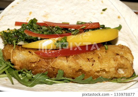 A very tasty fried pineapple taco with peppers and lime street food fresh meal A very tasty fried pineapple taco with peppers and lime street food fresh meal 133978877