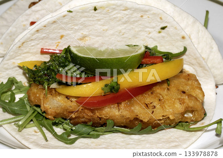 A very tasty fried pineapple taco with peppers and lime street food fresh meal A very tasty fried pineapple taco with peppers and lime street food fresh meal 133978878