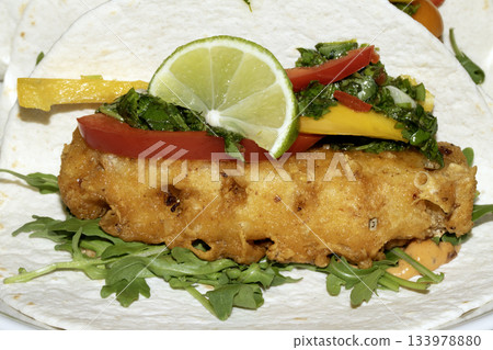 A very tasty fried pineapple taco with peppers and lime street food fresh meal A very tasty fried pineapple taco with peppers and lime street food fresh meal 133978880