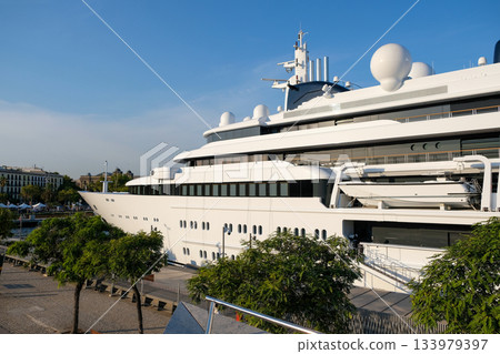 The cruise ship docked in Spain. 133979397