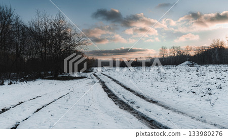 Snowy Rural Road at Sunset - Winter Countryside Landscape 133980276