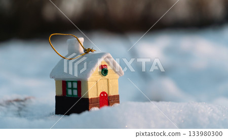 Miniature Christmas House Ornament in Snow at Sunset Miniature Christmas House Ornament in Snow at Sunset 133980300