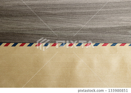 Vintage Airmail Envelope on Wooden Surface, Business Background, Blank Background, Top View Angle Image. High quality photo Vintage Airmail Envelope on Wooden Surface, Business Background, Blank Background, Top View Angle Image. High quality photo 133980851