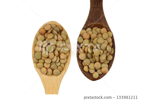 Pile lentil in wooden spoon isolated on White background. Top view. 133981211