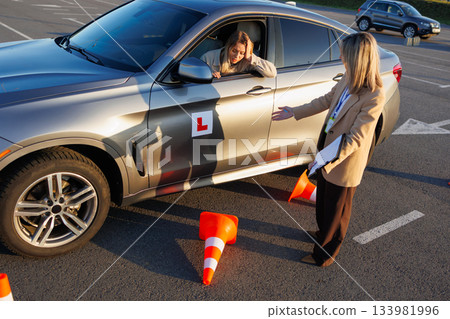 Learner Driver Reacting to Mistake as Instructor Explains Driving Error Learner Driver Reacting to Mistake as Instructor Explains Driving Error 133981996