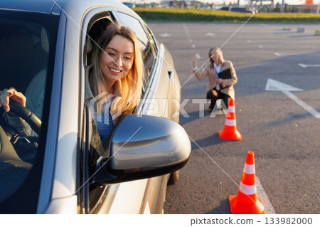 Learner Driver Engaged in Training as Instructor Guides Maneuver Steps Learner Driver Engaged in Training as Instructor Guides Maneuver Steps 133982000
