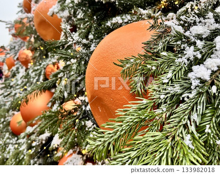 Bright Christmas Tree toys are hanging on the tree. New Year 133982018