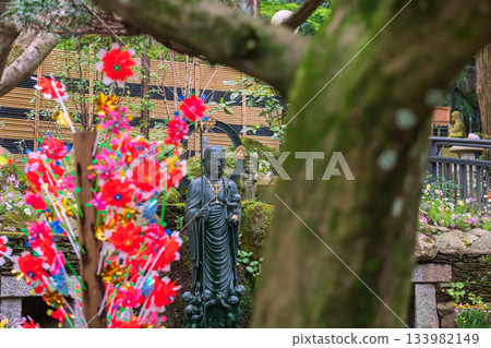 Jizo Bosatsu Buddha statue with flower toy of Nanzoin temple, Fukuoka Jizo Bosatsu Buddha statue with flower toy of Nanzoin temple, Fukuoka 133982149