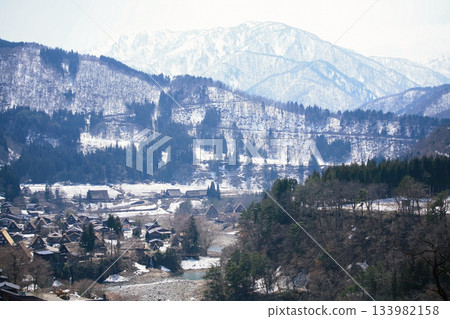 Snow covered Shirakawa-go old village in valley at winter, Gifu Snow covered Shirakawa-go old village in valley at winter, Gifu 133982158