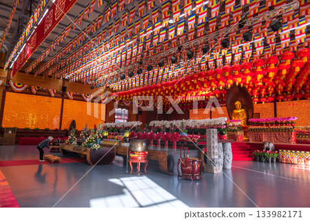 Old Chinese people sacred Gold Buddha inside Longhua temple, Shanghai 133982171