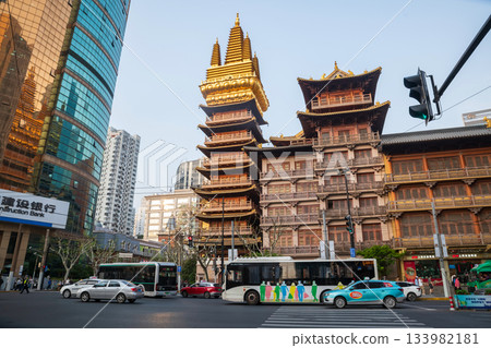 Jing'an temple and motion traffic vehicles on street intersection, Shanghai Jing'an temple and motion traffic vehicles on street intersection, Shanghai 133982181