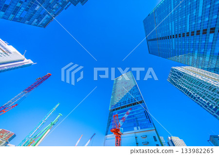 Tokyo cityscape in Japan, December. View of Shibuya's buildings and crawler cranes. Towards a new era Tokyo cityscape in Japan, December. View of Shibuya's buildings and crawler cranes. Towards a new era 133982265