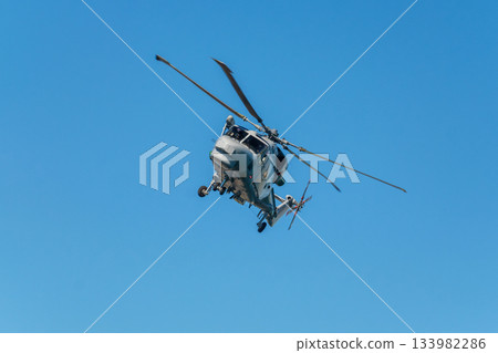 Military helicopter in sky 133982286