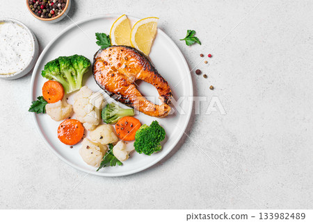 Healthy grilled fish salmon steak and vegetables Healthy grilled fish salmon steak and vegetables 133982489