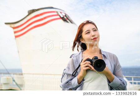 Camera girl on a cruise Camera girl on a cruise 133982616