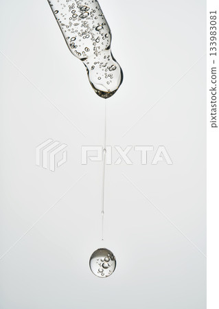 Cosmetic pipette dropping serum with air bubbles Cosmetic pipette dropping serum with air bubbles 133983081