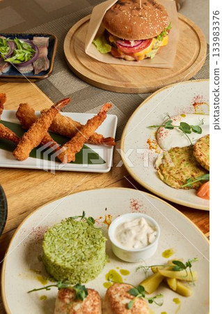 Different popular seafood specialties and burger varieties presented for informal social gathering Different popular seafood specialties and burger varieties presented for informal social gathering 133983376