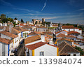 Stunning aerial view of Obidos, a medieval town in Portugal, showcasing its castle, city walls, and charming rooftops. Portugal 133984074