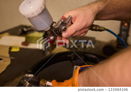 Professional techniques for vehicle leather renewal, Closeup image showcasing detailed work involved in restoring automobile leather upholstery with expert methods 133984106
