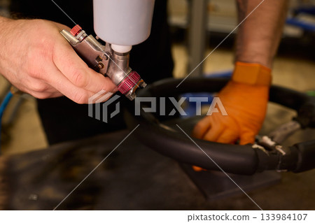 Professional techniques for vehicle leather renewal, Closeup image showcasing detailed work involved in restoring automobile leather upholstery with expert methods 133984107