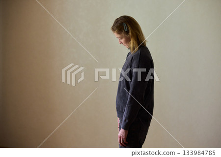 Woman exercises indoors, Individual with cerebral palsy performing warmup, Serene young woman with mobility challenges practicing controlled physiotherapy routines indoors Woman exercises indoors, Individual with cerebral palsy performing warmup, Serene young woman with mobility challenges practicing controlled physiotherapy routines indoors 133984785