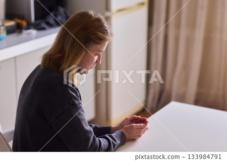 Self reliant woman handles morning pills in peaceful kitchen setting, Woman with cerebral palsy diligently manages her daily medication routine independently at home Self reliant woman handles morning pills in peaceful kitchen setting, Woman with cerebral palsy diligently manages her daily medication routine independently at home 133984791