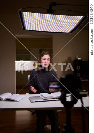 Young lady with cerebral palsy studying using technological aids, Enthusiastic woman with cerebral palsy learning with aid of modern assistive technology at bright workspace Young lady with cerebral palsy studying using technological aids, Enthusiastic woman with cerebral palsy learning with aid of modern assistive technology at bright workspace 133984840