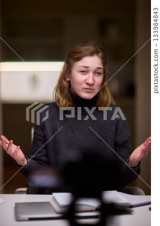 Young lady with cerebral palsy studying using technological aids, Enthusiastic woman with cerebral palsy learning with aid of modern assistive technology at bright workspace 133984843